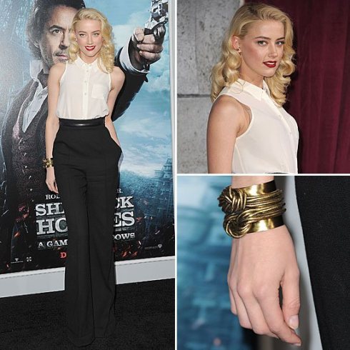 Maybe you don't want to go to extremes. No problem! Amber Heard adds more feminine touches to her look, but the high waist pants give her just enough masculinity to make this look a sexy combination of both. It has a retro androynous feeling.